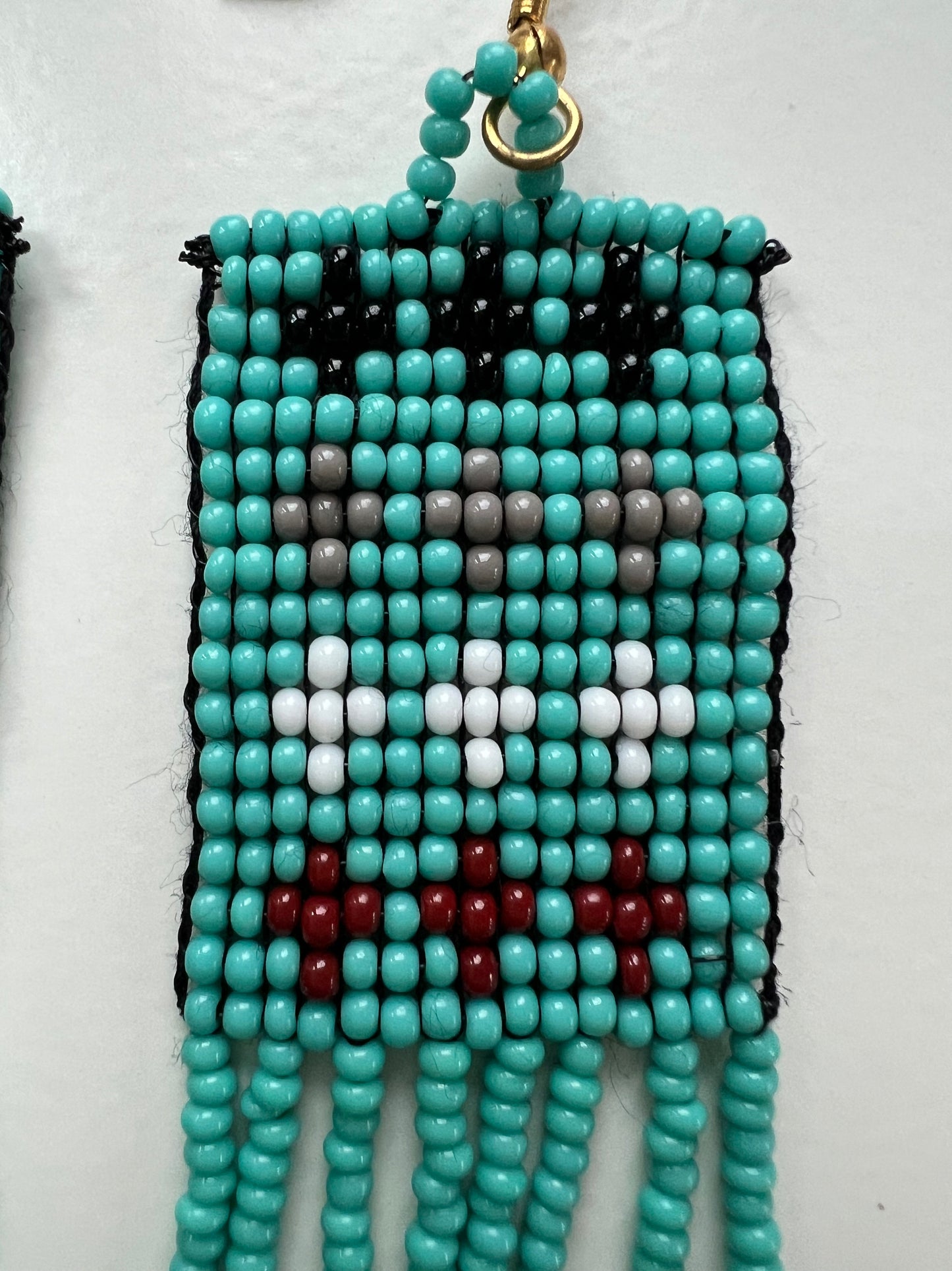 Light blue with crosses hanging beaded earrings