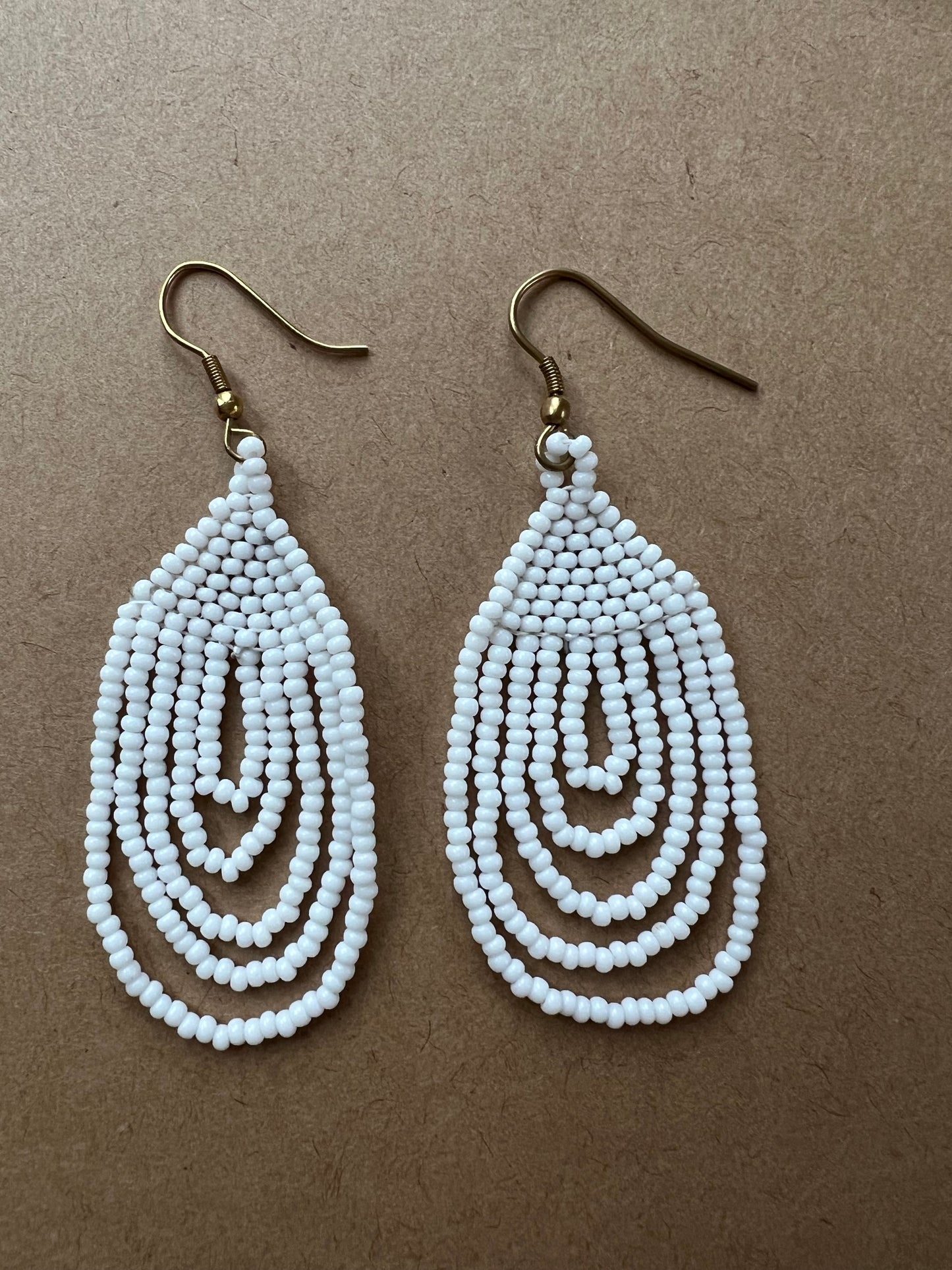 
                  
                    White hanging beaded earrings
                  
                
