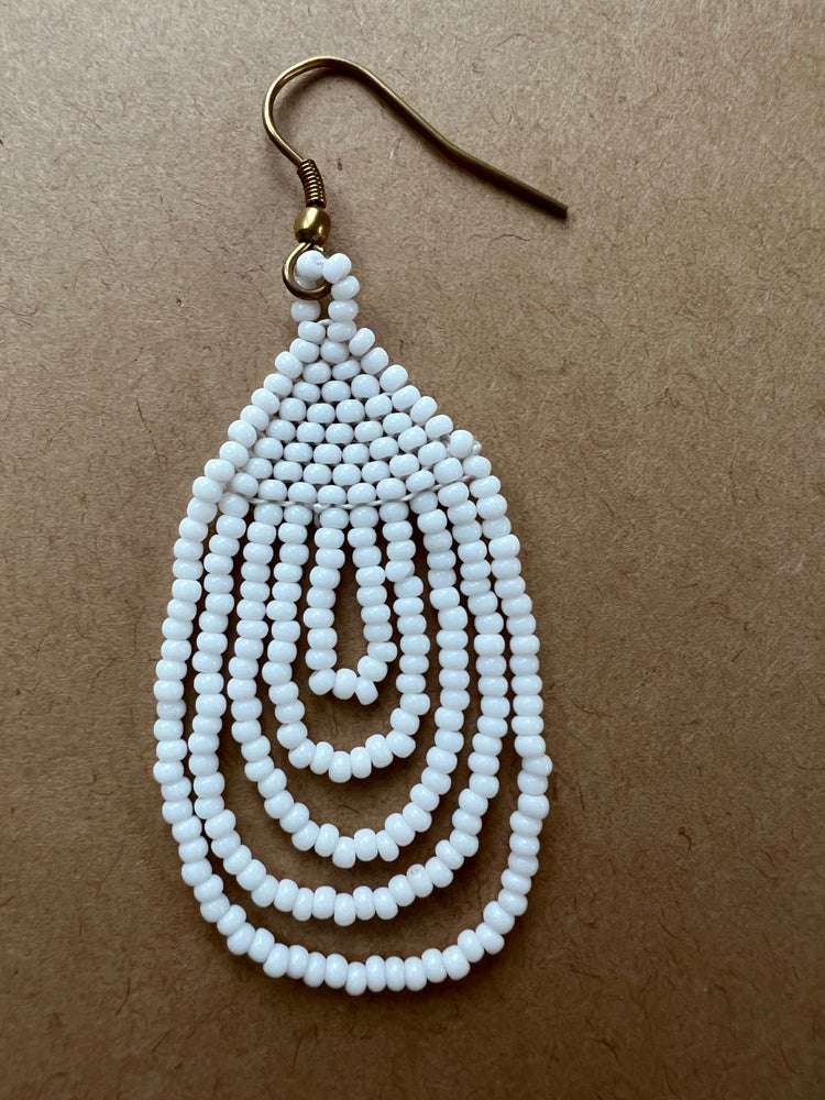 
                  
                    White hanging beaded earrings
                  
                